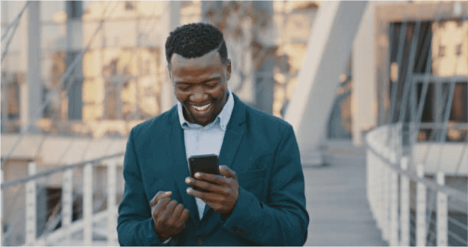 african american man looking at his mobile phone