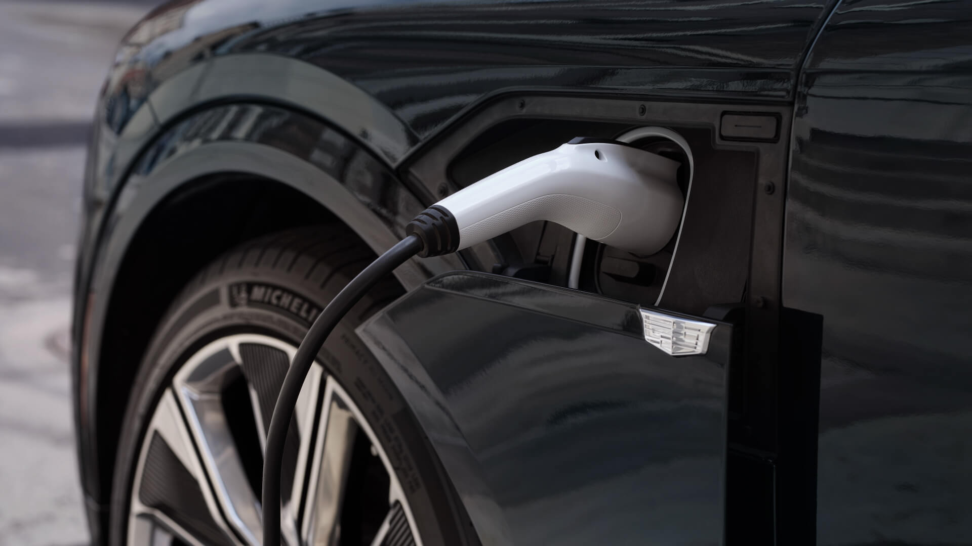 Closeup of a Cadillac electric vehicle charger hookup