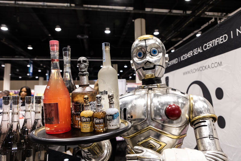 Robot carrying tray of various wines in bottles