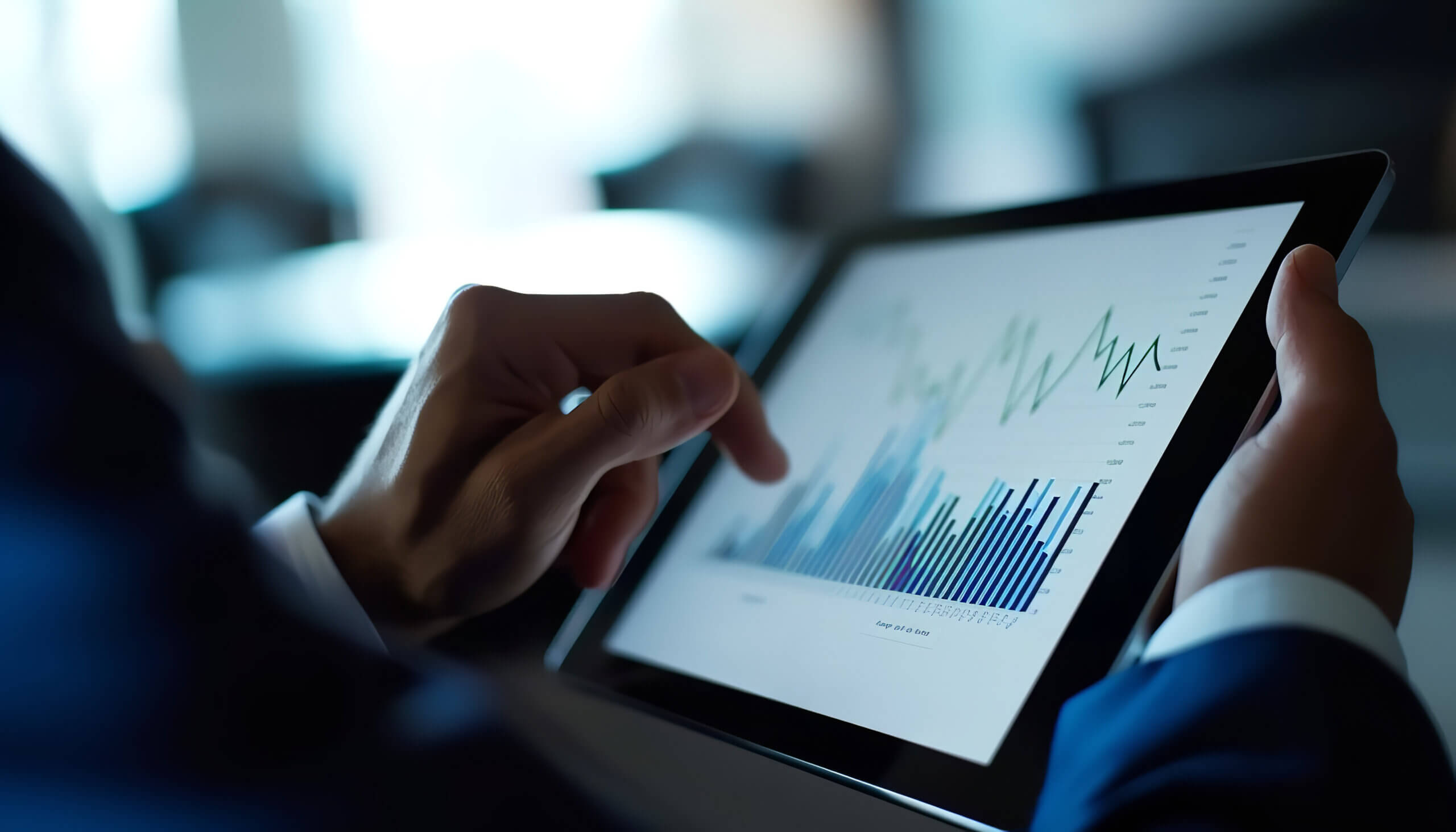 zoomed in image of man's hands on tablet