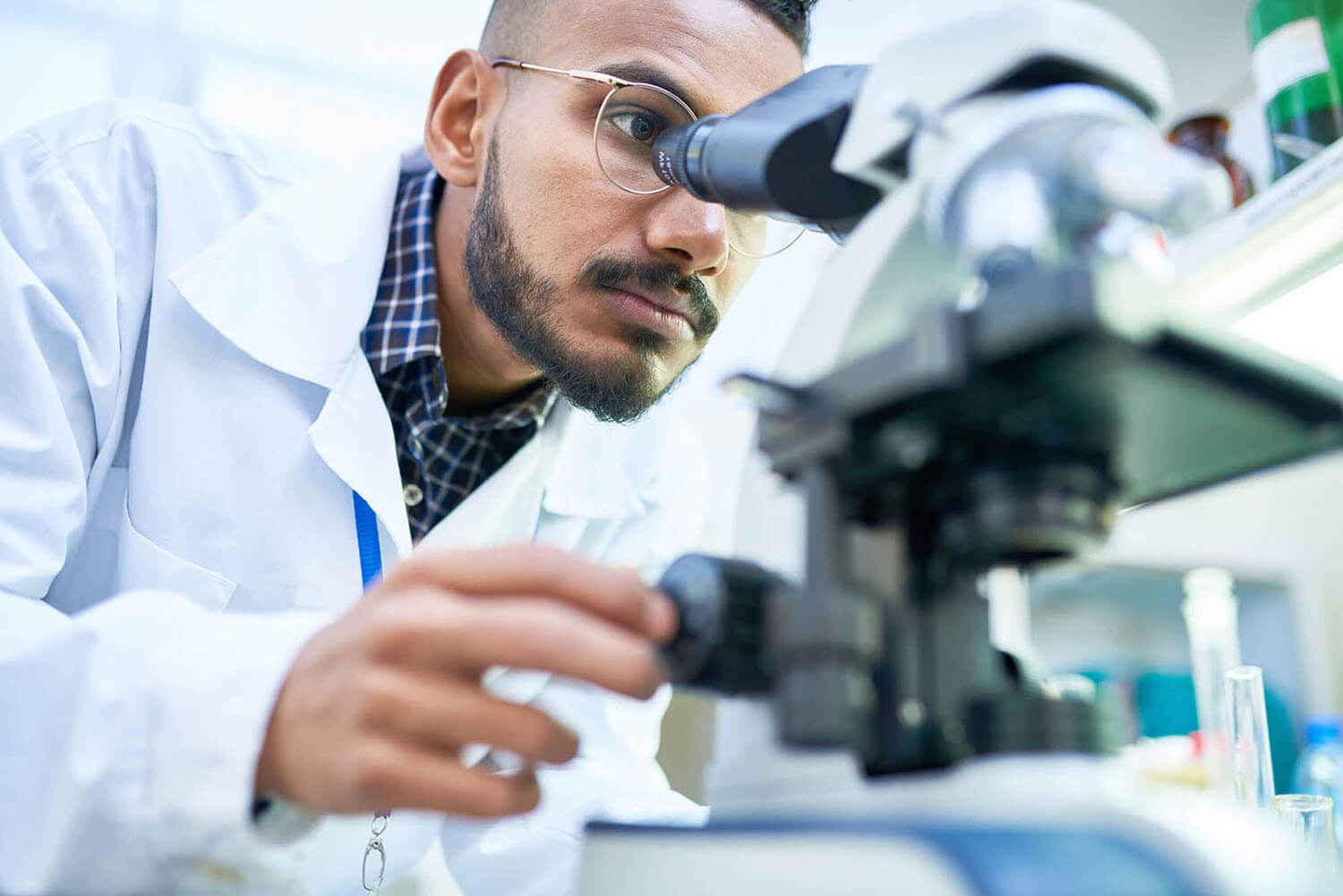 Scientist Using Microscope in Laboratory