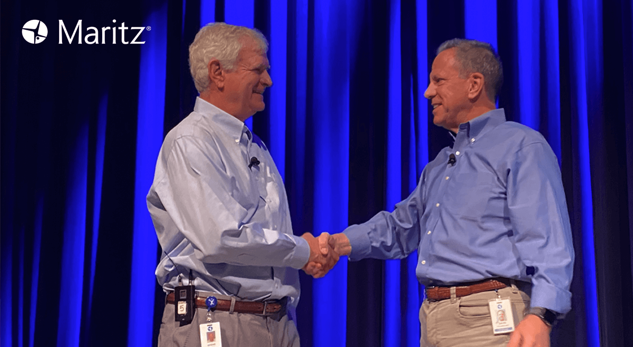 David Peckinpaugh and Steve Maritz shaking hands on stage