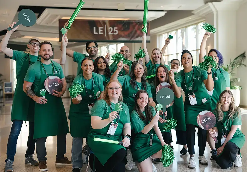 Event crew of men and women wearing all green