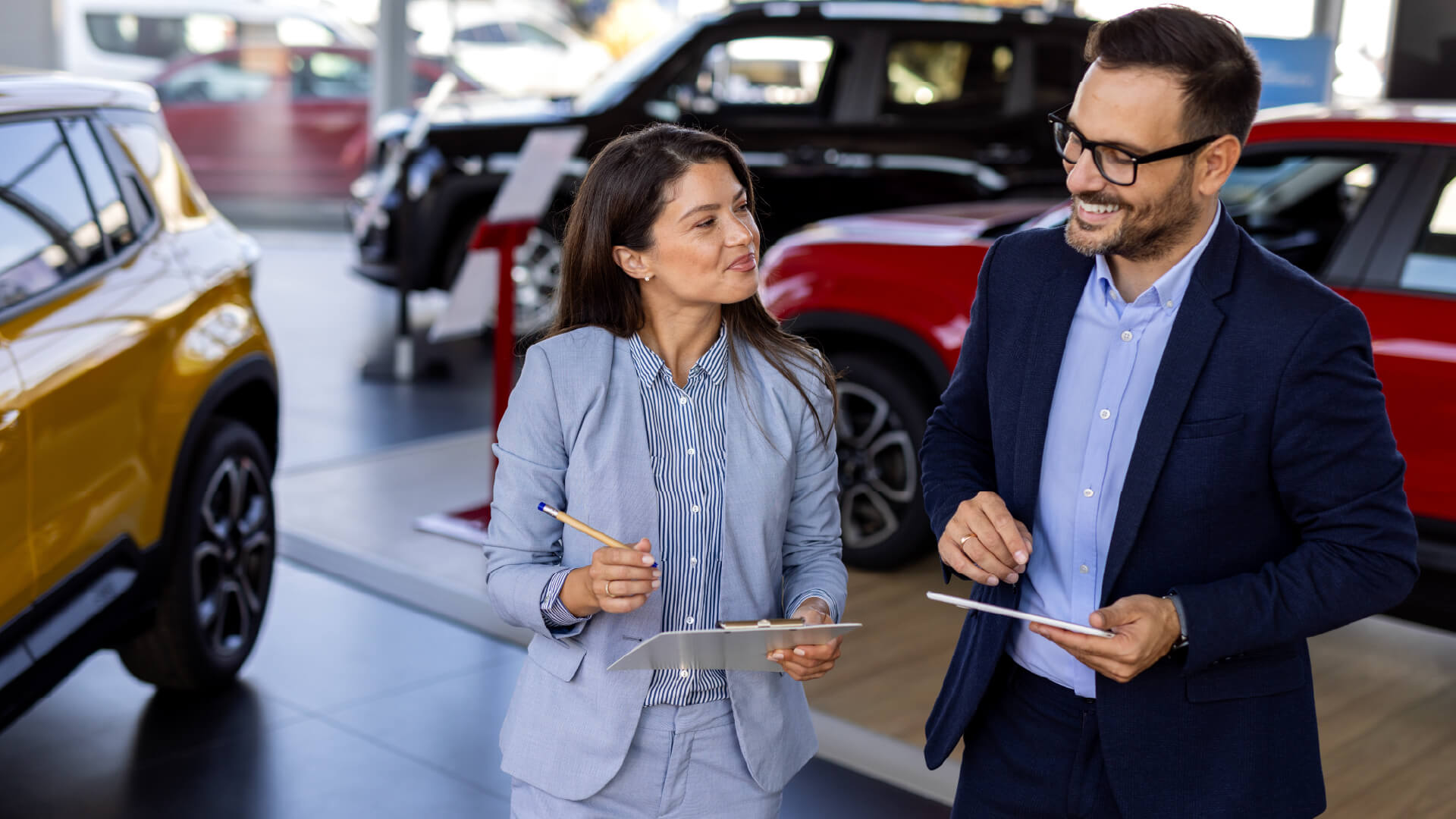 Customer engaging with a guided digital experience inside a modern car showroom