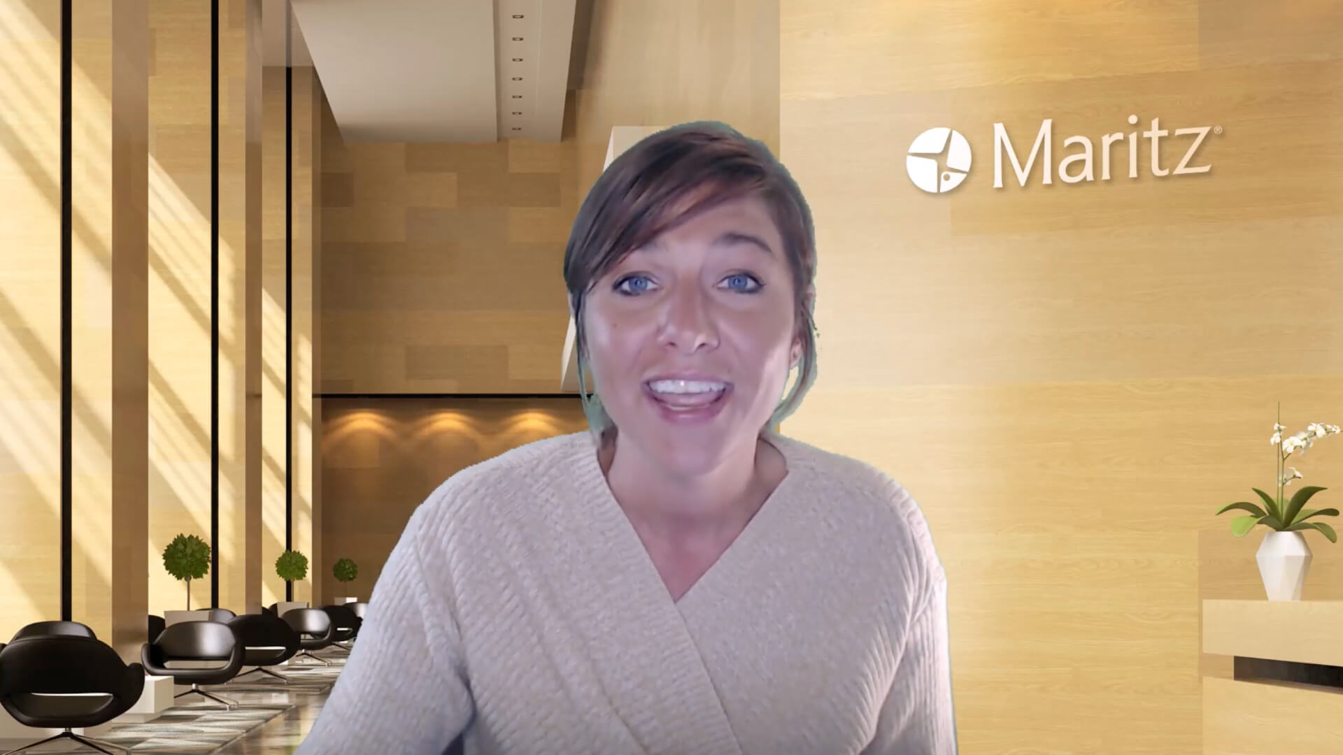 image showing a person on a video call in a professional office setting